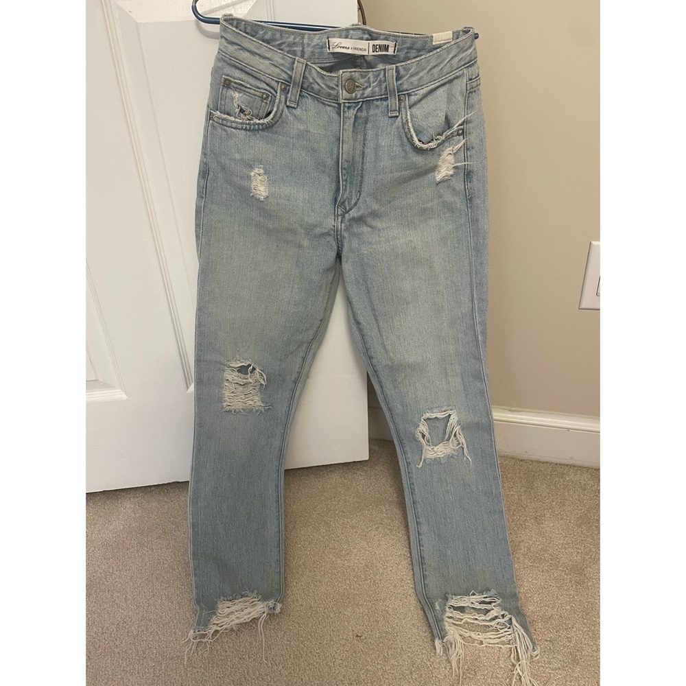 NEW and unworn. Great condition. Lovers & Friends light wash ripped jeans.